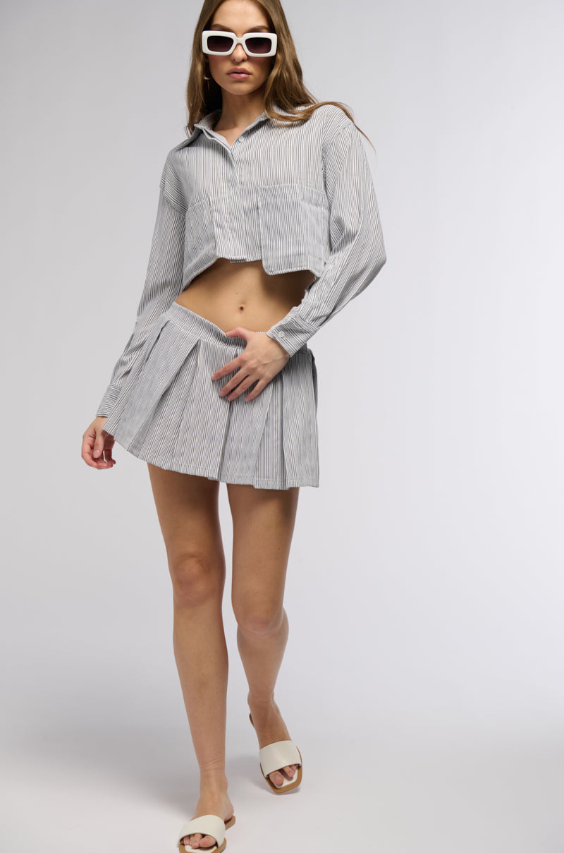 LEAVE IT BETTER PLEATED MINI SKIRT